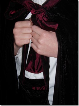 Winter cape with bag detail